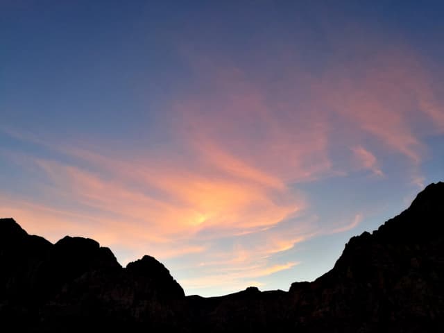 Photo of the sunset over mountains