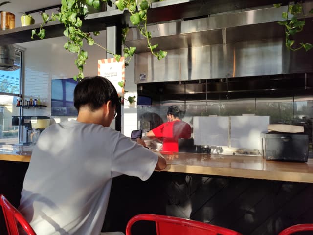 Photo of a guy at a counter