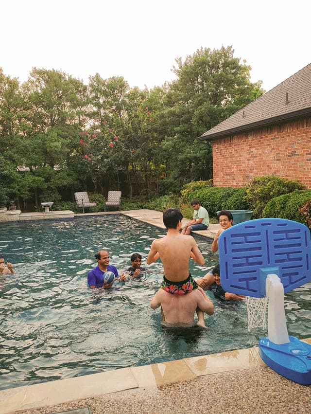 Photo of friends playing in the pool
